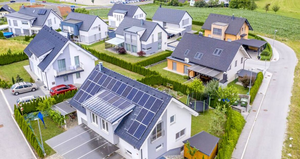 aerial-view-private-houses-with-solar-panels-roofs-1170x620