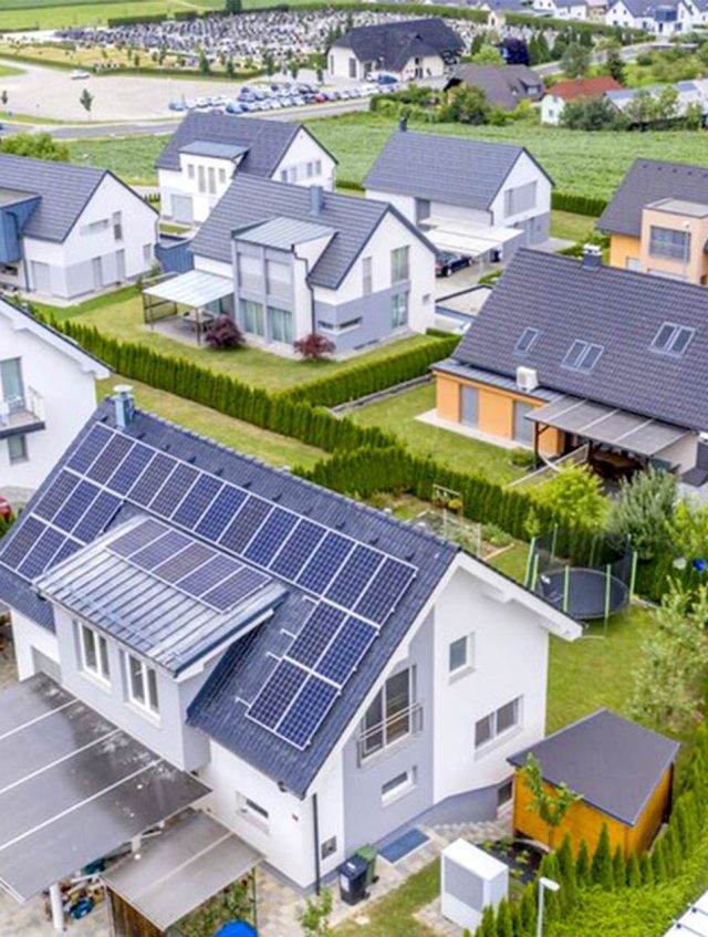 aerial-view-private-houses-with-solar-panels-roofs-1170x620